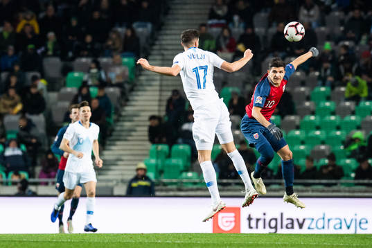 Miha Mevlja of Slovenia and Tarik Elyounoussi of Norway