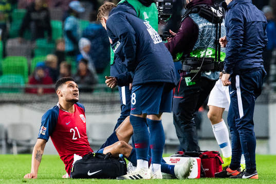 Bjørn Maars Johnsen of Norway receives medical attention