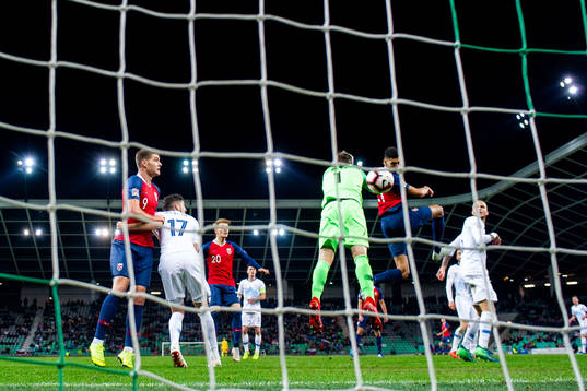 Bjørn Maars Johnsen of Norway scores the 1-1 goal behind