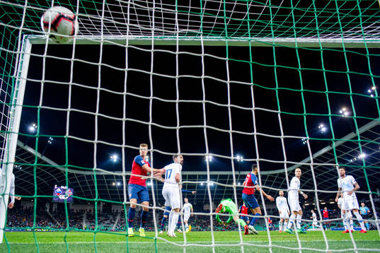 Bjørn Maars Johnsen of Norway scores the 1-1 goal behind
