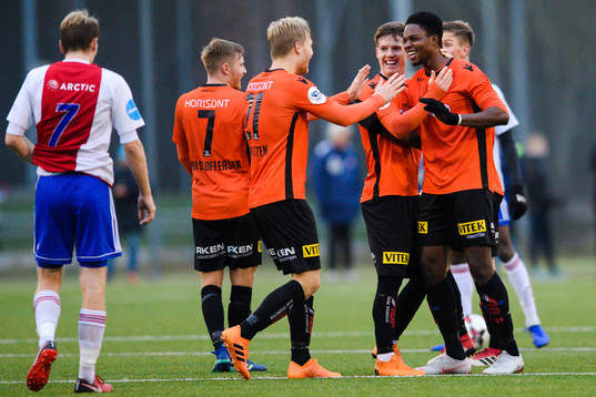 Michael Ogungbaro of Åsane celebrates with teammates
