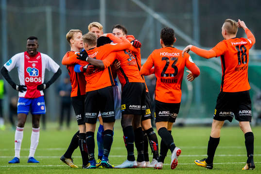 Michael Ogungbaro of Åsane celebrates with his teammates