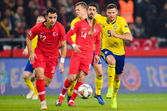 Kaan Ayhan Rögles and Marcus Berg of Sweden