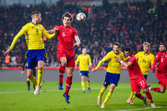 Mikael Lustig of Sweden and Caglar Söyuncu of Turkey