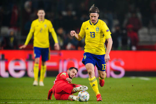 Hakan Calhanoglu of Turkey and Gustav Svensson of Sweden