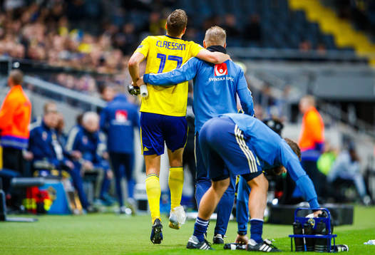 Viktor Claesson of Sweden receives help