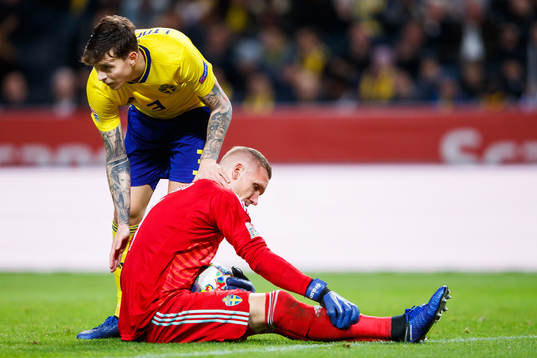 Victor Nilsson Lindelöf and goalkeeper Robin Olsen of