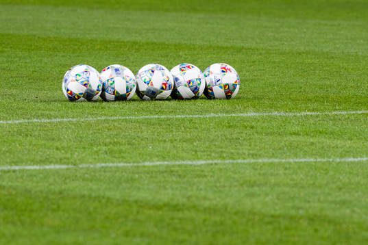 Five footballs