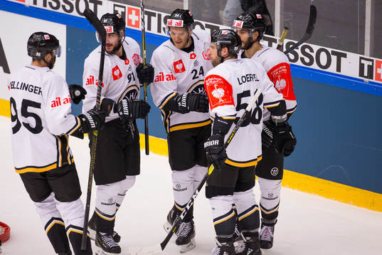 Jani Lajunen celebrates scoring 1-3 with team mates