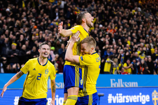 Mikael Lustig, Sebastian Larsson, and Marcus Berg of Sweden