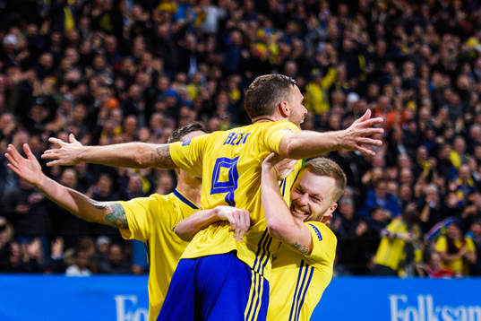 Marcus Berg and Sebastian Larsson of Sweden celebrates