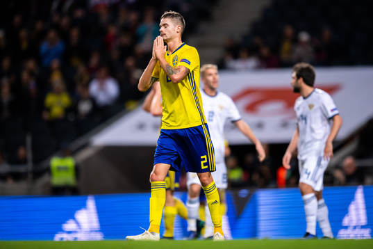 Mikael Lustig of Sweden looks dejected