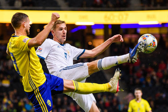 Anton Zabolotny of Russia and Marcus Berg of Sweden