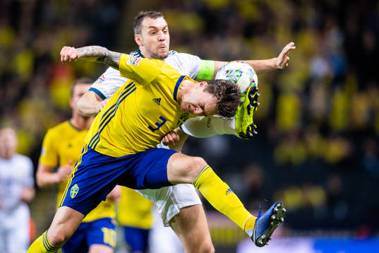 Victor Nilsson Lindelöf of Sweden and Artem Dzyuba of
