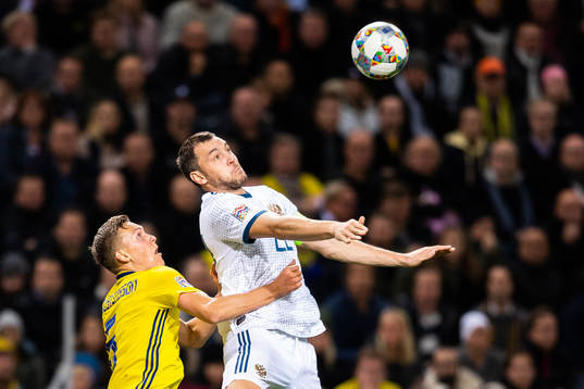 Ludwig Augustinsson of Sweden and Artem Dzyuba of Russia