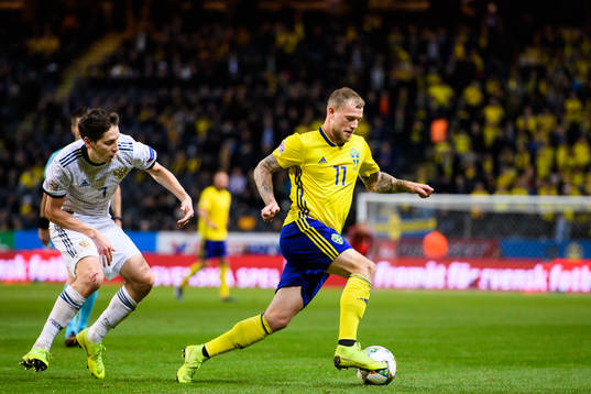 Daler Kuziaev of Russia and John Guidetti of Sweden