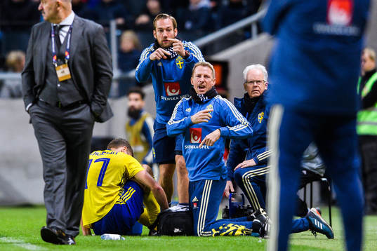 Viktor Claesson of Sweden receives medical attention