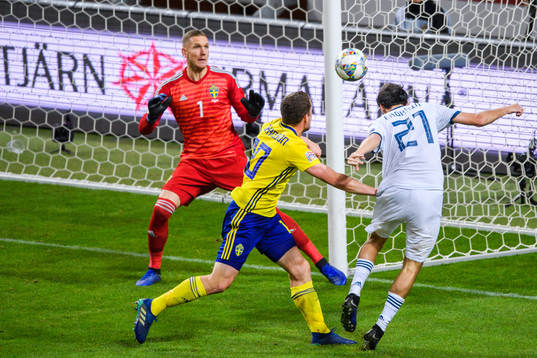 Aleksandr Erokhin of Russia in a duel with goalkeeper Robin
