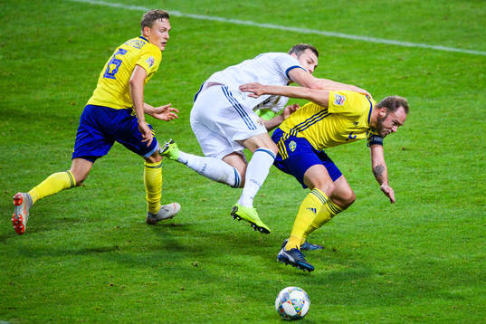 Ludwig Augustinsson and Andreas Granqvist of Sweden in a