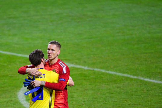 Gustav Svensson and goalkeeper Robin Olsen of Sweden