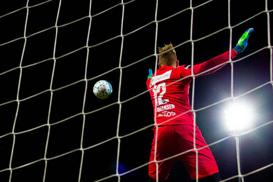Goalkeeper Eirik Johansen of Sandefjord saves an attempt