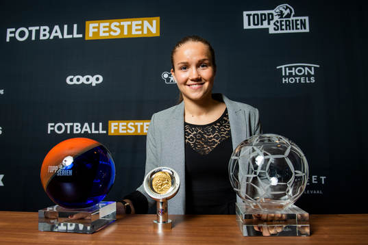 Guro Reiten of LSK Kvinner poses with her three awards