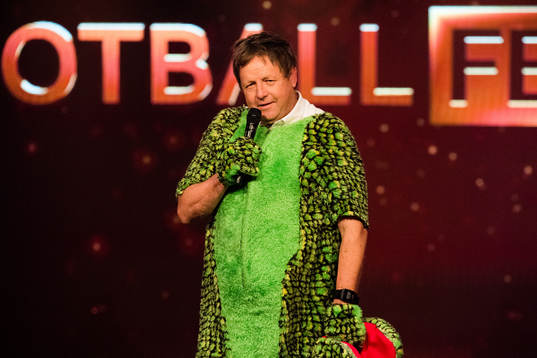 Bjarne Berntsen, coach of Viking, in a dinosaur costume