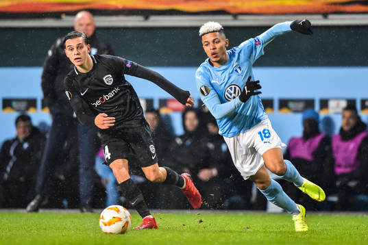 Leandro Trossard of Genk and Romain Gall of Malmö FF