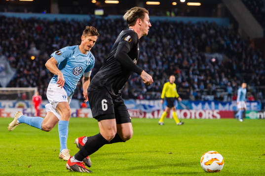 Markus Rosenberg of Malmö FF and Sebastien Dewaest of Genk