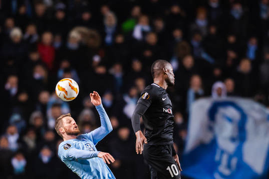 Lasse Nielsen of Malmö FF and Mbwana Samatta of Genk