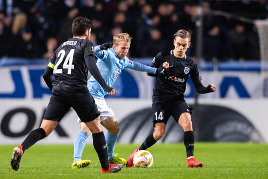 Oscar Lewicki of Malmö FF and Leandro Trossard of Genk