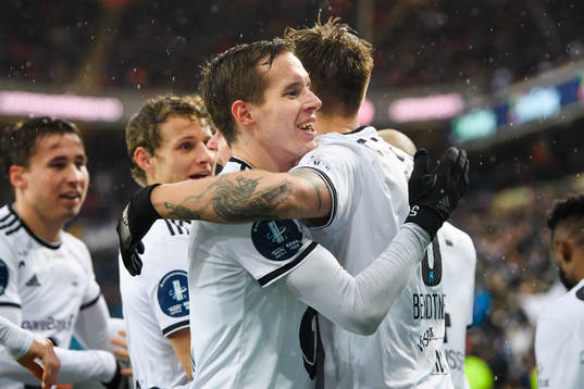 Nicklas Bendtner of Rosenborg celebrates with teammate