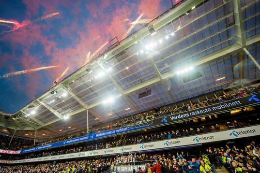 Players of Rosenborg celebrate with fireworks