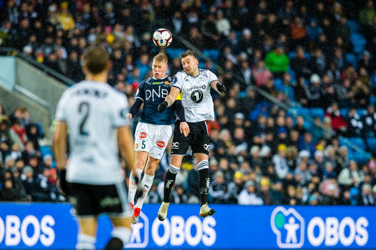 Jakob Glesnes of Strømsgodset and Nicklas Bendtner of