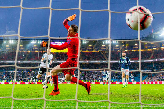 Nicklas Bendtner of Rosenborg scores 4-1 behind goalkeeper