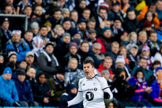 Pål André Helland of Rosenborg celebrates while being