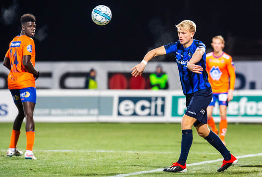 Jørgen Hatlehol of Aalesund watches Andreas Hanche-Olsen