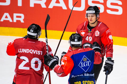 Joel Lundqvist and Ryan Lasch celebrate with Rhett Rakshani
