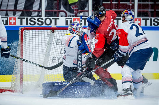 Lars Bryggman of Malmö Redhawks and goalkeeper Danny Aus