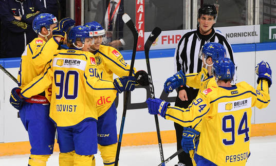 Sweden's players celebrate 2nd team's goal