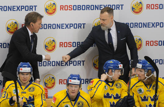 Sweden's head coach Rikard Gronborg, right, and coach Johan