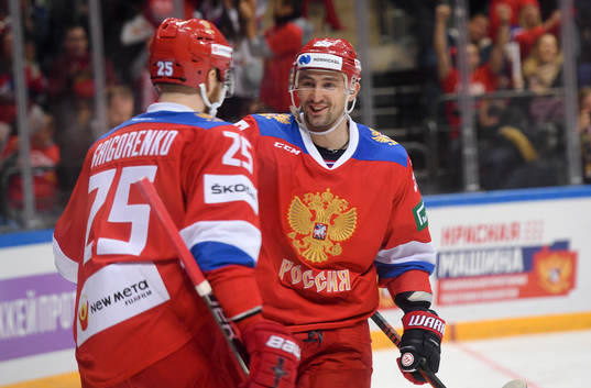Russia's Mikhail Grigorenko, left, celebrates his goal with