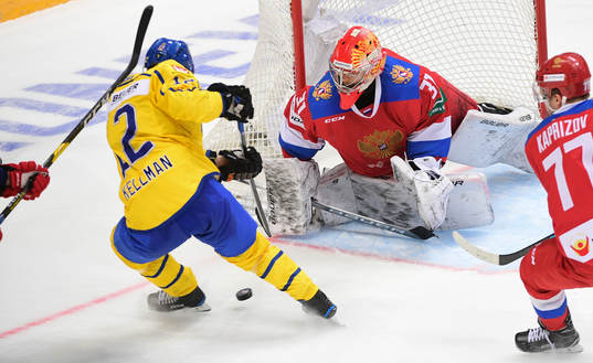 Sweden's Joel Kellman tries to score against Russia's