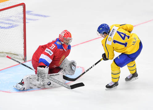 Sweden's Jakob Lilja, right, fails to score against