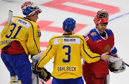 Sweden's goalie Lars Johansson, left, Klas Dahlbek, centre,