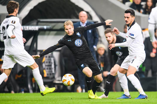 Oscar Lewicki of Malmö FF and Mustafa Pektemek of Besiktas