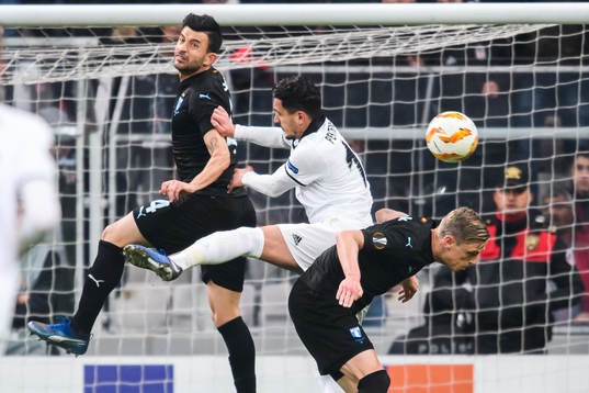 Behrang Safari and Sören Rieks of Malmö FF in a duel with