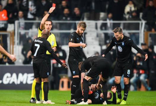 Referee Luca Bonti gives a red card to Ricardo Quaresma of