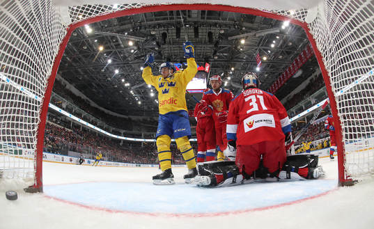 Sweden's Michael Lindqvist reacts as Russia's goalie Ilya