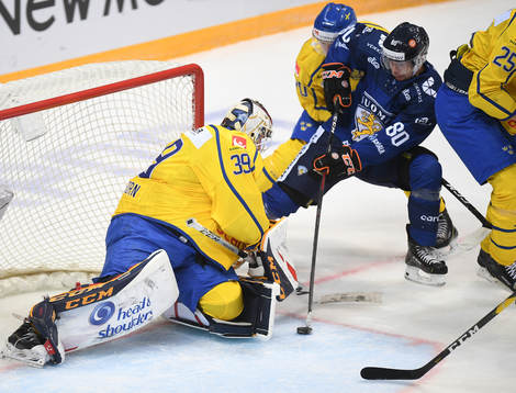 Finland's Teemu Turunen, right, tries to score against